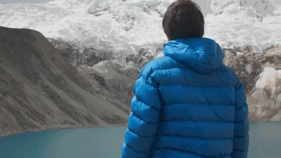 The glaciologist Martin Mergili. In the background, you can see a glacier breaking away.